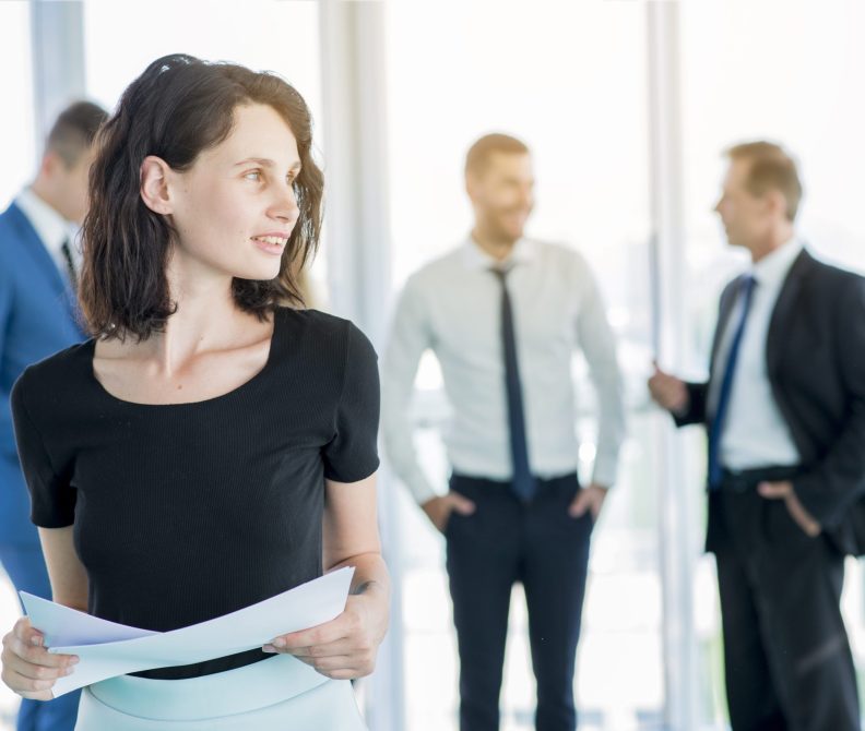 businesswoman-with-documents-looking-away